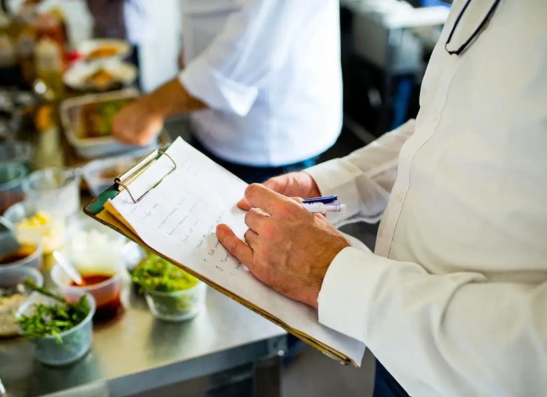 Printed operations manual and SOP documents for Tabla Franchise